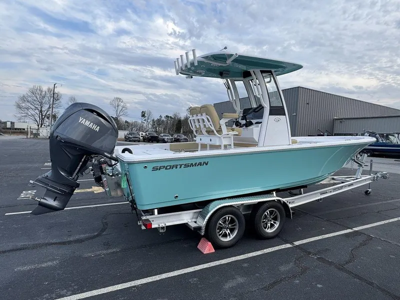 Slide: The Image of 2025 Sportsman Masters 227 boat on trailer with Yamaha engine in parking lot. - 4
