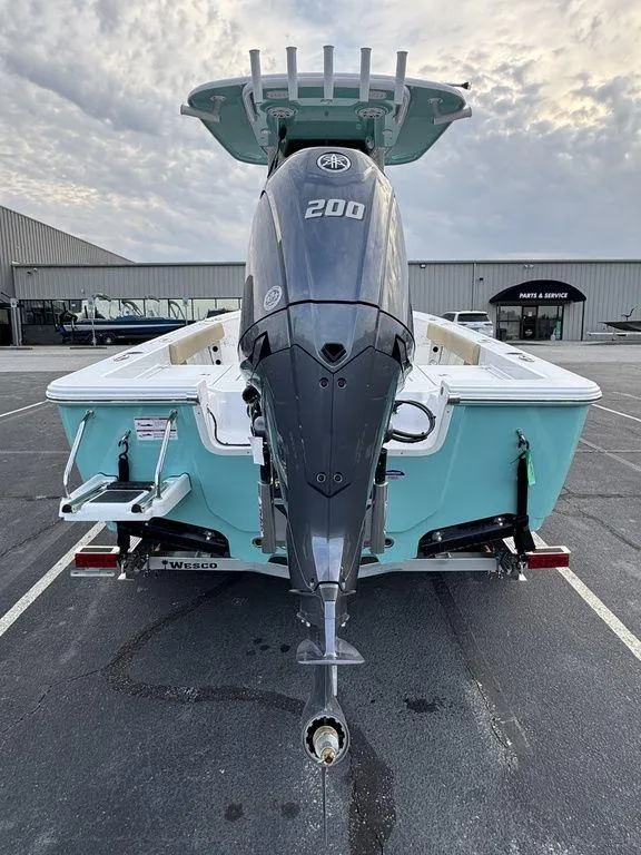 Slide: The Image of 2025 Sportsman Masters 227 boat with powerful 200 HP engine, parked outdoors. - 5