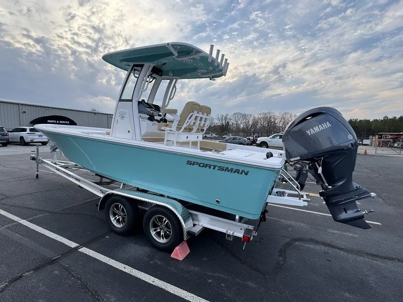 Slide: The Image of 2025 Sportsman Masters 227 boat on trailer, featuring Yamaha engine, parked outdoors under cloudy sky. - 6