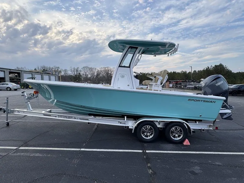 Slide: The Image of 2025 Sportsman Masters 227 boat on trailer, parked outdoors under cloudy sky. - 7