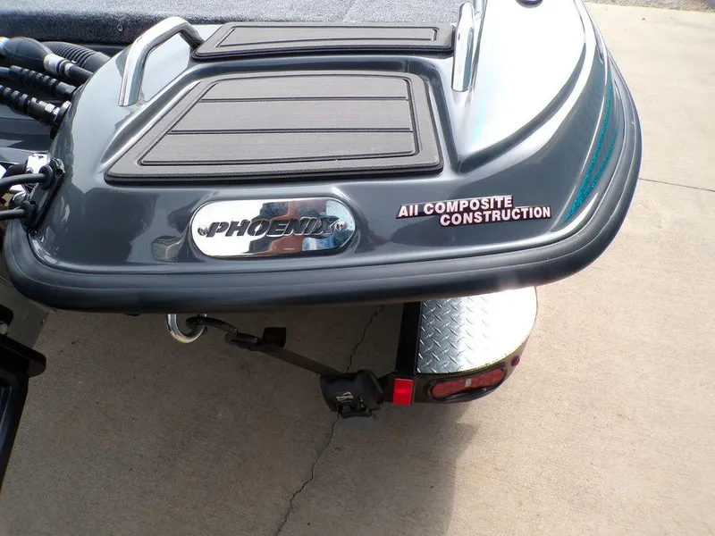Slide: The Image of 2025 Phoenix 721 ZXL boat with all composite construction, rear view on trailer. - 12