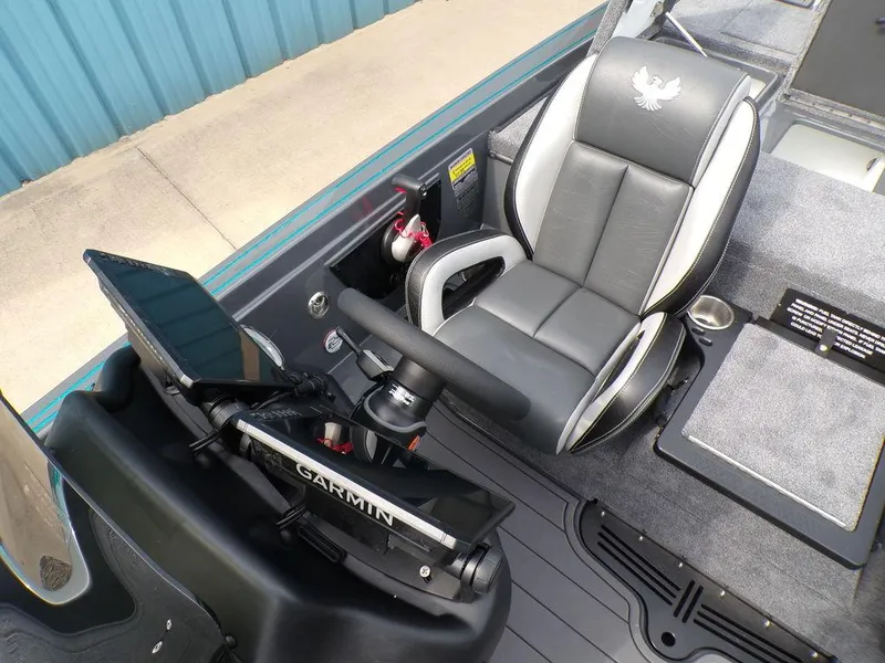 Slide: The Image of 2025 Phoenix 721 ZXL boat cockpit with Garmin system and cushioned seat. - 15