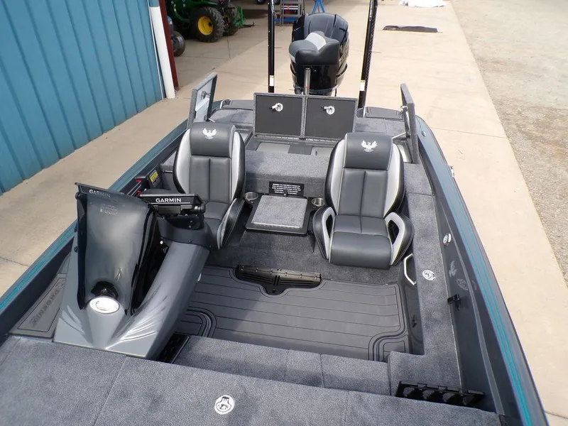 Slide: The Image of 2025 Phoenix 721 ZXL boat interior with dual seats and Garmin equipment. - 16