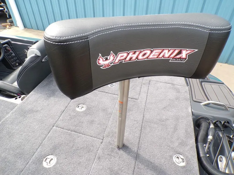 Slide: The Image of 2025 Phoenix 721 ZXL boat seat with logo, gray carpeted deck, and blue background. - 18