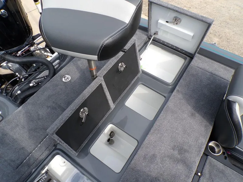 Slide: The Image of 2025 Phoenix 721 ZXL boat interior with open storage compartments and seating. - 23