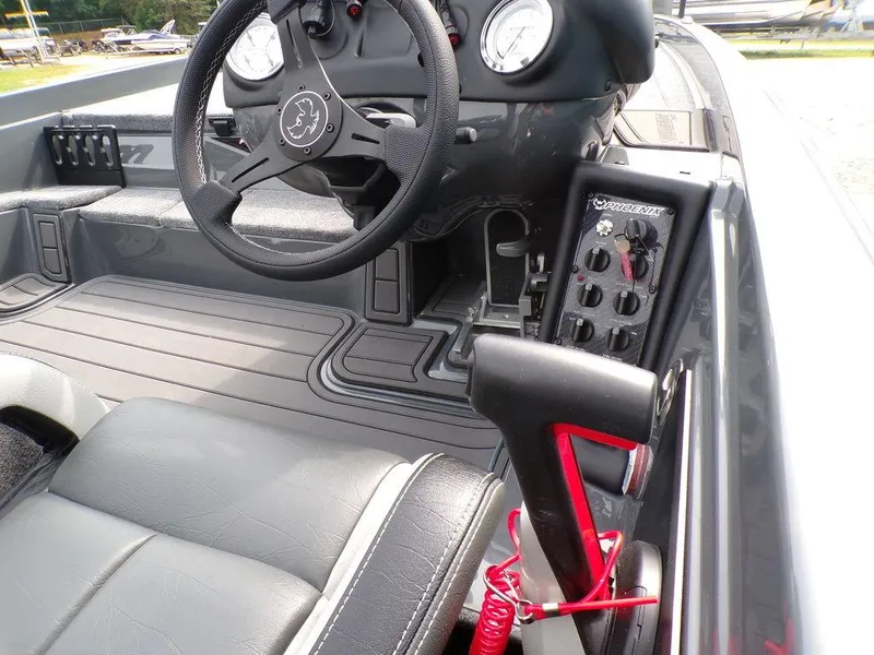 Slide: The Image of Interior of 2025 Phoenix 721 ZXL boat, featuring steering wheel and control panel. - 4