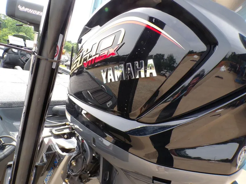 Slide: The Image of Close-up of a Yamaha outboard motor on a 2025 Phoenix 721 ZXL boat. - 7