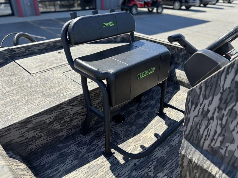 Slide: The Image of 2025 Havoc 1965 UCC boat seat with camouflage design in outdoor setting. - 10