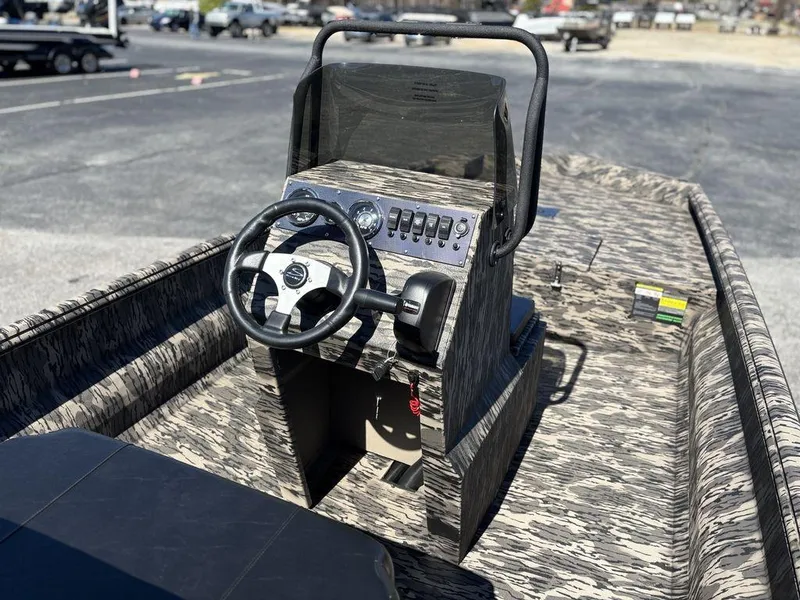 Slide: The Image of Interior of 2025 Havoc 1965 UCC boat with steering console and controls. - 12