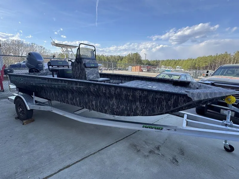 Slide: The Image of 2025 Havoc 1965 UCC boat on trailer, outdoors, under blue sky. - 6