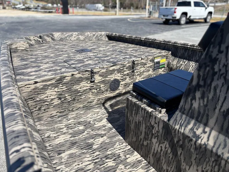 Slide: The Image of Camouflage-patterned 2025 Havoc 1965 UCC boat interior with storage compartments. - 7