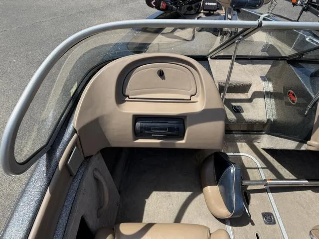 Slide: The Image of Interior of a 2000 Ranger R97 boat showing dashboard and seating area. - 4