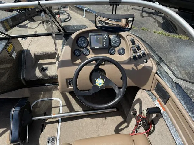 Slide: The Image of Steering console of a 2000 Ranger R97 boat with gauges and controls. - 5