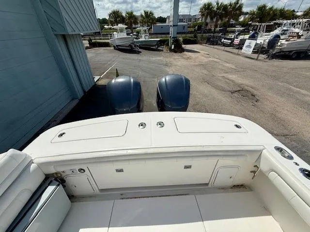 Slide: The Image of 2017 Regulator 31 boat with dual engines, docked at a marina. - 14