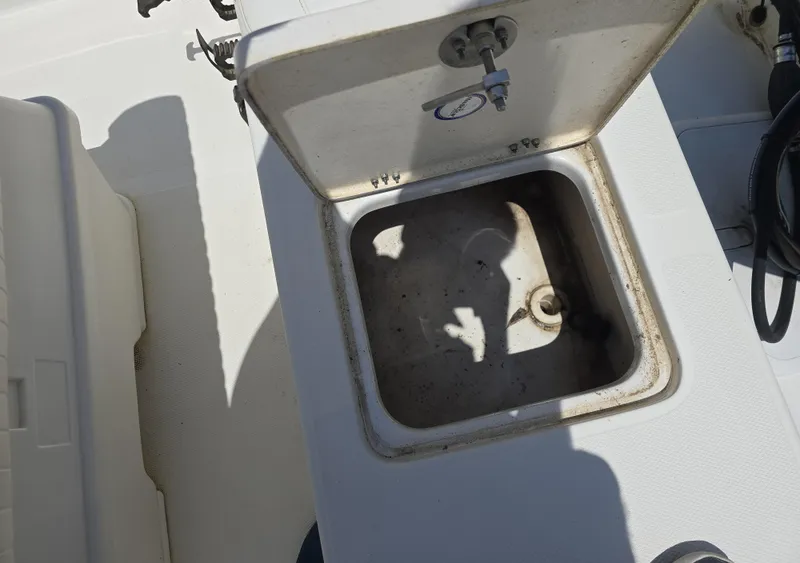 Slide: The Image of Open storage compartment on 2010 NauticStar 1810 Nautic Bay boat. - 11