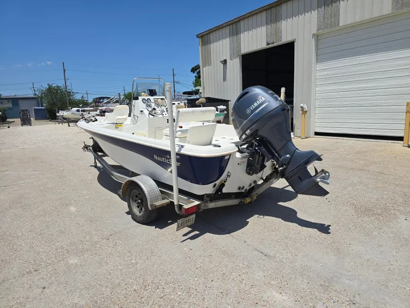 Slide: The Image of 2010 NauticStar 1810 Nautic Bay boat with Yamaha outboard motor on trailer. - 3