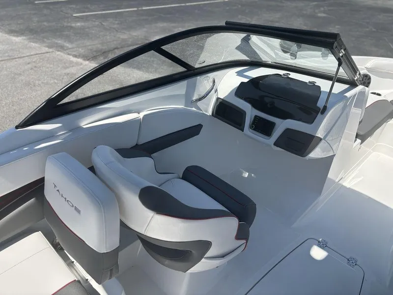 Slide: The Image of 2024 Tahoe 210 S boat interior with sleek seating and modern dashboard design. - 15