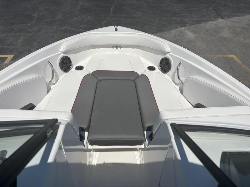 Slide: The Image of 2024 Tahoe 210 S boat interior with cushioned seating and speakers. - 17