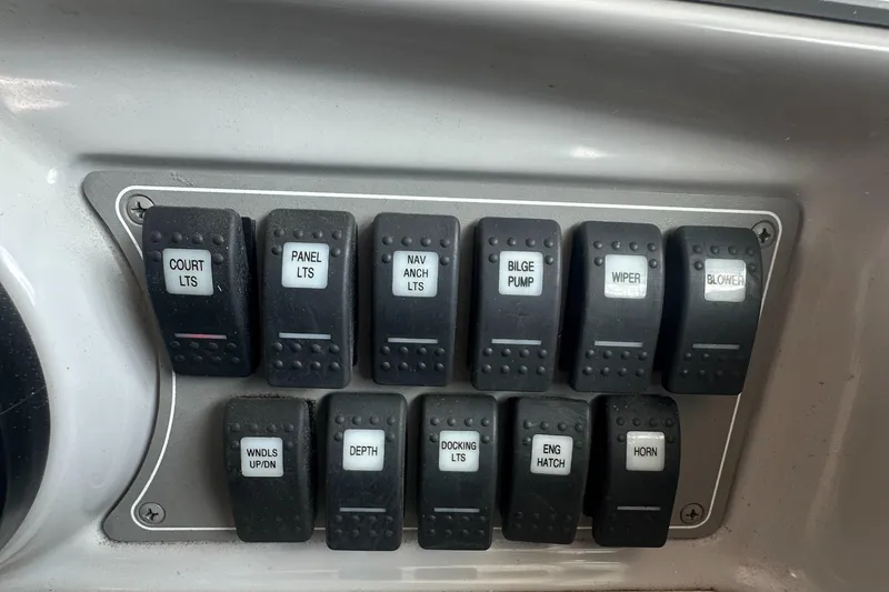 Slide: The Image of Control panel of a 1998 Formula 330 SunSport boat with labeled switches. - 17