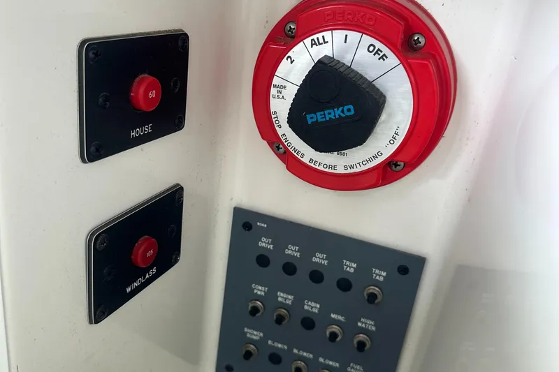 Slide: The Image of Control panel of a 1998 Formula 330 SunSport boat with Perko switch and buttons. - 20