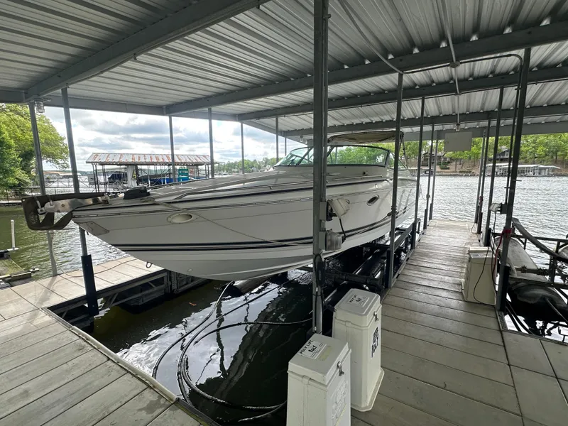 Slide: The Image of 1998 Formula 330 SunSport boat docked in covered marina slip. - 3