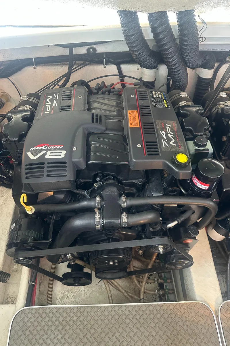 Slide: The Image of 1998 Formula 330 SunSport engine, MerCruiser V8, 7.4 MPI, in a boat compartment. - 33