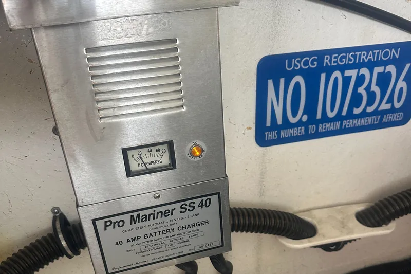 Slide: The Image of Pro Mariner SS 40 battery charger and USCG registration on 1998 Formula 330 SunSport. - 35