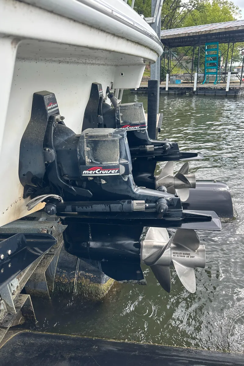 Slide: The Image of 1998 Formula 330 SunSport boat with dual MerCruiser outboard engines in water. - 37