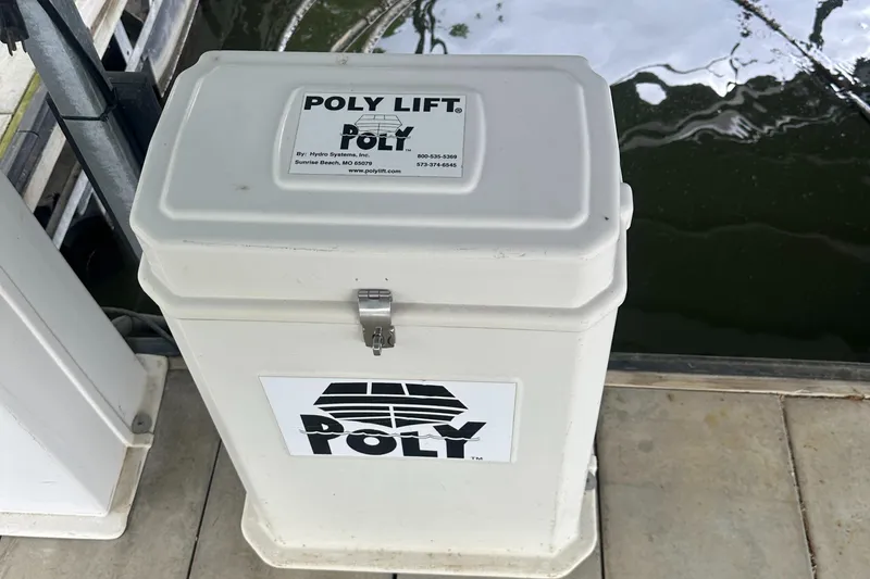 Slide: The Image of Poly Lift control box on dock near water, associated with 1998 Formula 330 SunSport. - 40