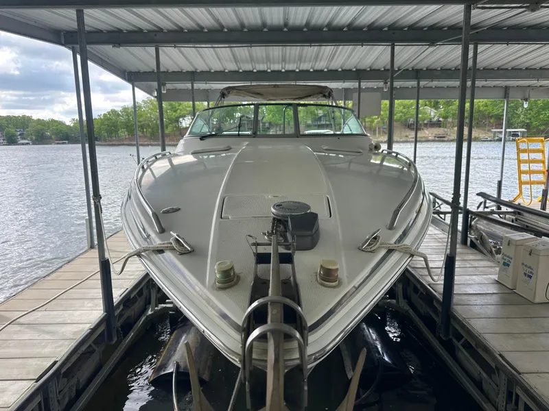 Slide: The Image of 1998 Formula 330 SunSport boat docked under a covered marina. - 5