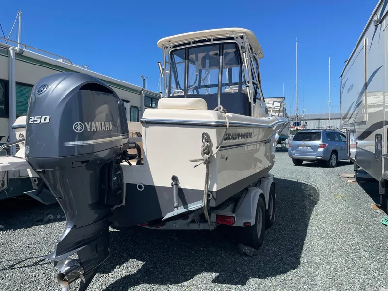 Slide: The Image of 2015 Grady-White Seafarer 226 boat with Yamaha 250 engine, parked on gravel lot. - 19