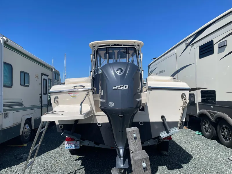Slide: The Image of 2015 Grady-White Seafarer 226 boat with Yamaha 250 engine, parked between RVs. - 20