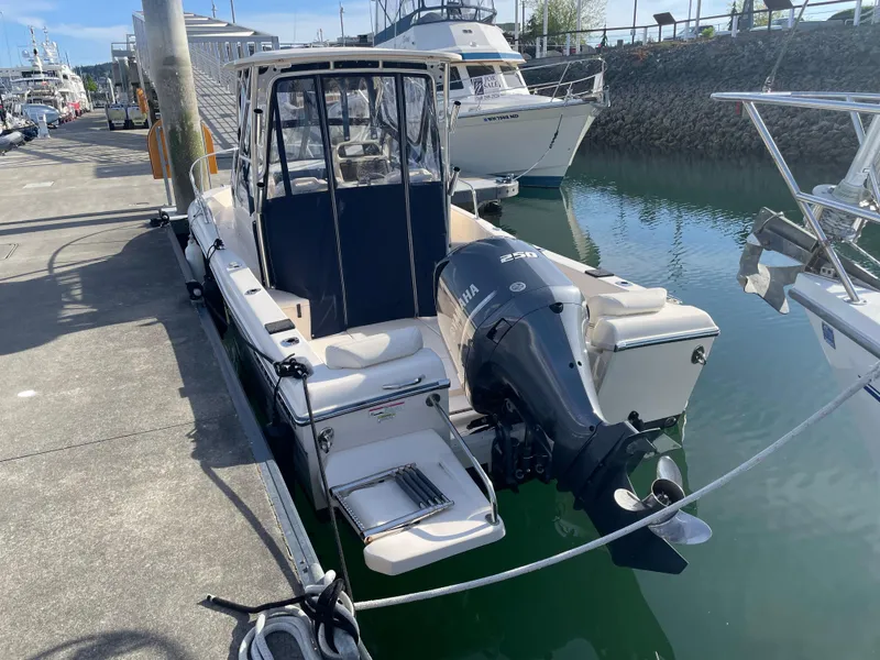 Slide: The Image of 2015 Grady-White Seafarer 226 boat docked with Yamaha outboard motor. - 3