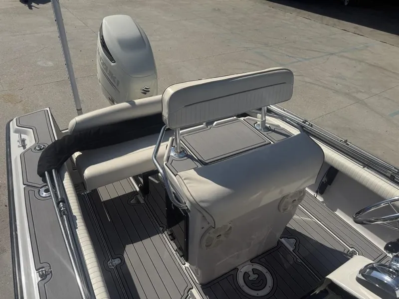 Slide: The Image of 1996 Boston Whaler 21 Outrage boat interior with seating and steering console. - 15