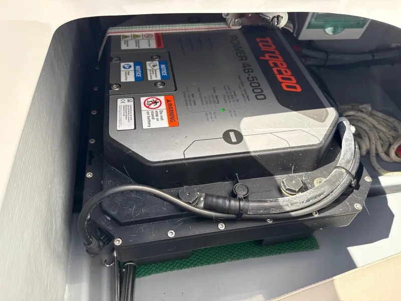 Slide: The Image of Battery compartment of a 2022 Rand Picnic boat featuring a Torqeedo Power 48-5000 system. - 7