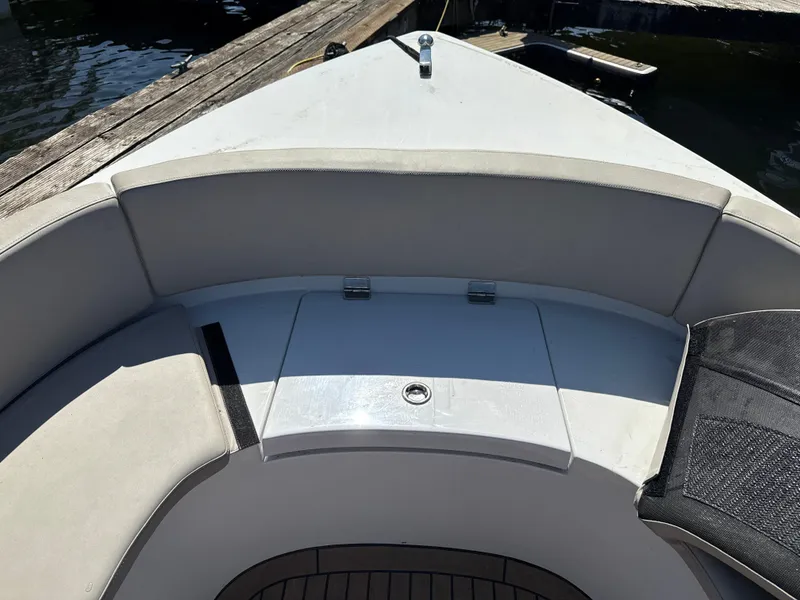 Slide: The Image of Rand Picnic 2022 boat interior with cushioned seating and storage compartment. - 9