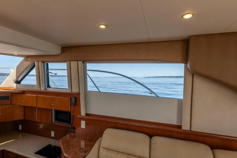Slide: The Image of Interior view of 2006 Silverton 42 Convertible yacht with ocean backdrop. - 15