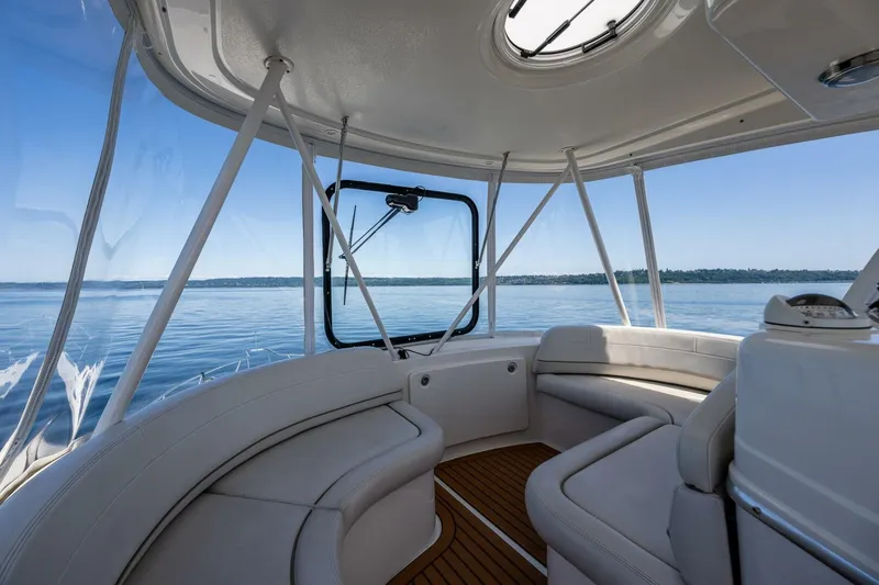Slide: The Image of Interior view of 2006 Silverton 42 Convertible yacht with panoramic windows and plush seating. - 26
