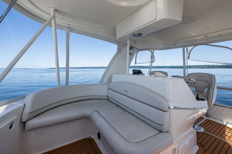 Slide: The Image of 2006 Silverton 42 Convertible yacht interior with plush seating and panoramic ocean view. - 27