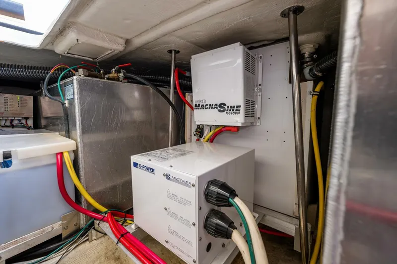 Slide: The Image of Engine room of 2006 Silverton 42 Convertible with electrical components and wiring. - 31