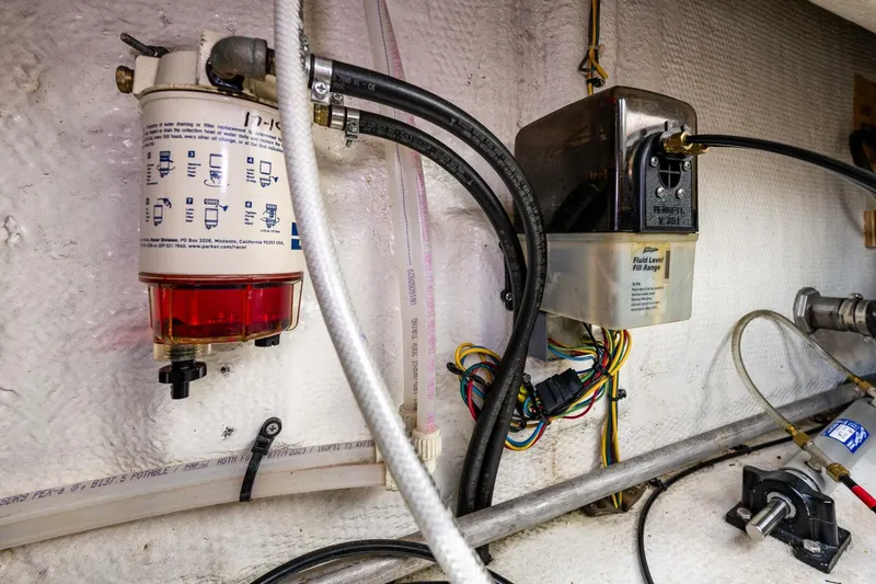 Slide: The Image of Engine compartment of a 2006 Silverton 42 Convertible with fuel filter and wiring. - 32