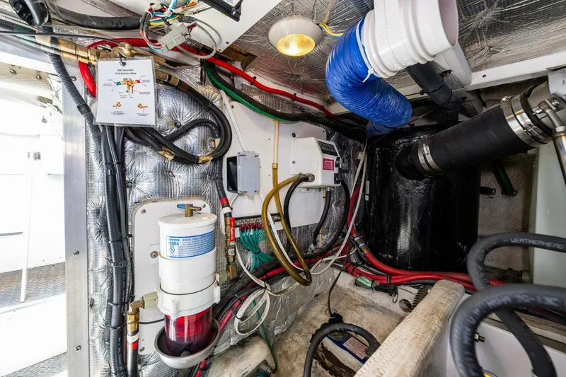 Slide: The Image of Engine room of 2006 Silverton 42 Convertible with wiring and mechanical components. - 33