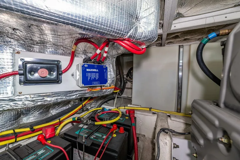 Slide: The Image of Engine room of 2006 Silverton 42 Convertible with batteries and wiring. - 35
