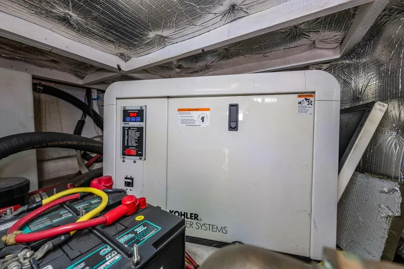 Slide: The Image of Engine room of 2006 Silverton 42 Convertible with Kohler power system and battery. - 36