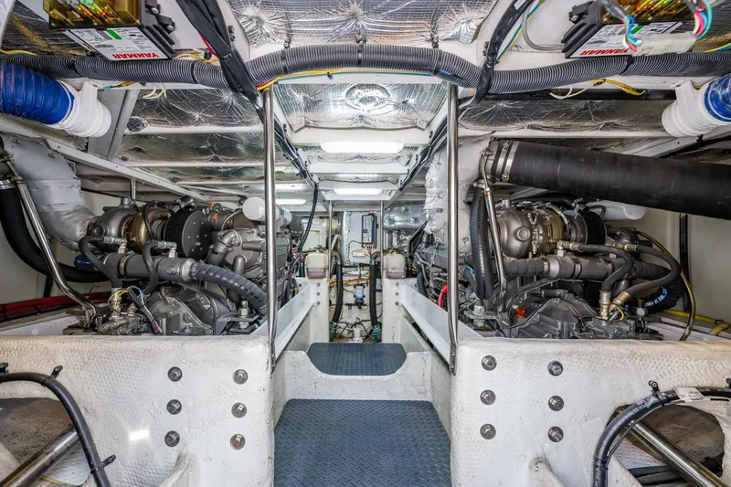 Slide: The Image of Engine room of 2006 Silverton 42 Convertible yacht, showcasing dual engines and mechanical systems. - 37