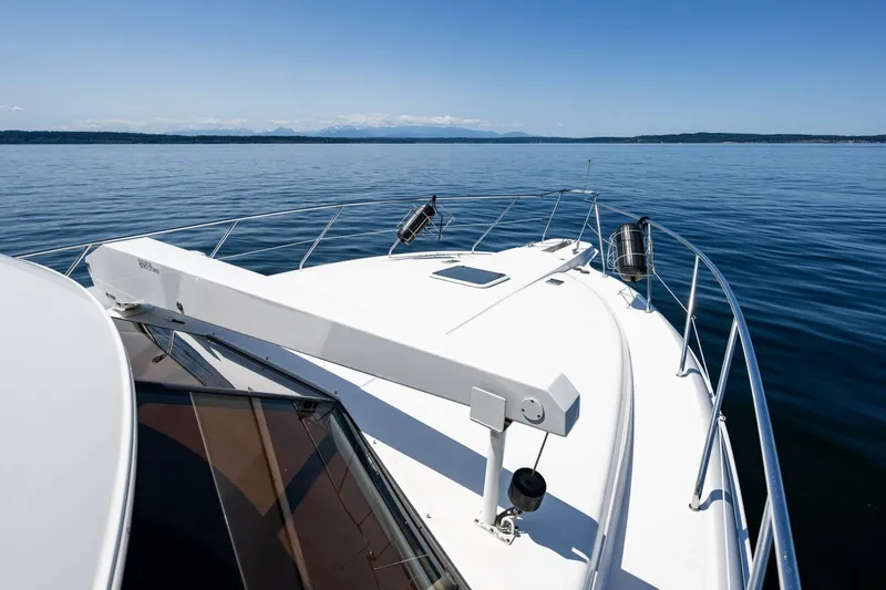 Slide: The Image of 2006 Silverton 42 Convertible yacht on calm water with clear blue sky. - 41