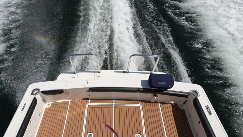 Slide: The Image of 2006 Silverton 42 Convertible boat deck with wake trails in water. - 46