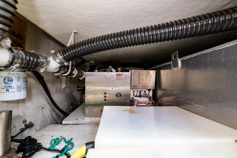 Slide: The Image of Engine room of a 2006 Silverton 42 Convertible yacht, showcasing mechanical components. - 47