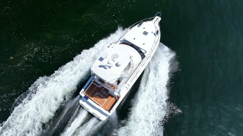 Slide: The Image of Aerial view of 2006 Silverton 42 Convertible yacht cruising on open water. - 48