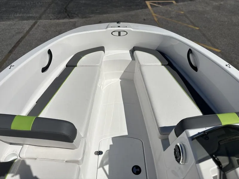 Slide: The Image of 2024 Tahoe T16 boat interior with white seating and green accents. - 10